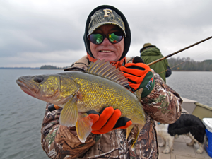 image of fisherman with Walleye caught in cold weather