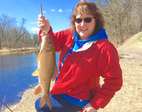 image of Mary Castellano with prairie river sucker