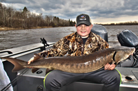 image of logan sathre with sturgeon