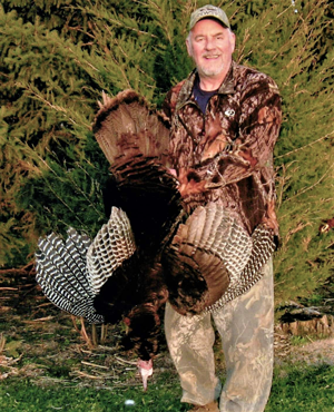 image of hunter with turkey