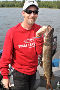 image of man with northern pike