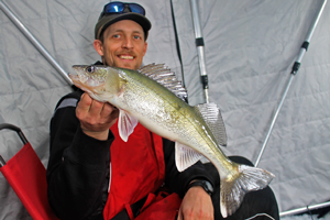 image of justin bailey with red lake walleye