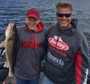 image of josh hagemeister and client with big walleye