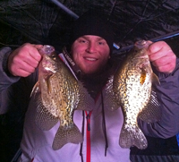 image of ice fisherman holding Crappies
