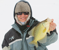 image of Travis DeWitt holding Bowstring Lake Crappie