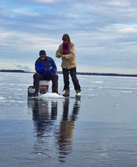 image of couple ice fishing on Ball Club Lake