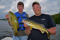 image of Mavis and Austin Jones holding fish that they caught