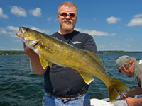 image of Austin Jones with giant Walleye