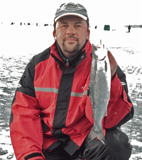 image of Brian Castellano with Coho Salmon