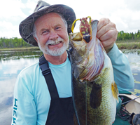 image of Greg Clusiay with giant Bass