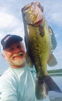 image of Greg Clusiau with huge Largemouth Bass