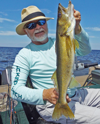 image of greg clusiau with big walleye