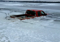 image of pickup truck breaking through ice on Pokegama Lake