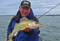 image of Jeff Sundin holding large Leech Lake Walleye