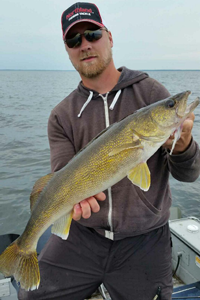 image of Mark Thompson with big winnie walleye