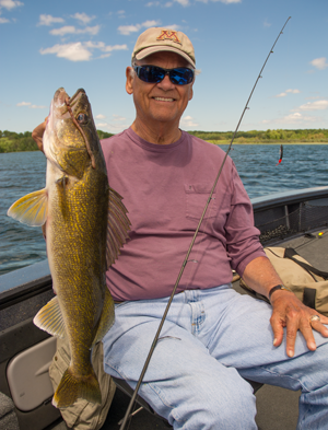 image of bob carlson with big Walleye