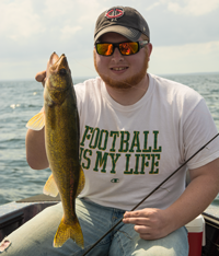 image of Cody Hauke with nice Walleye