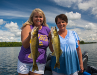 image of Bev Swenson and Susan Bolos with pair of big walleyes