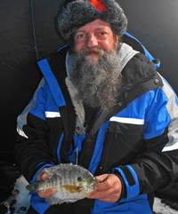 image of man holding bluegill