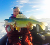 image of Mary Walsh with lake winnipeg walleye