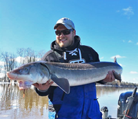 image of brett mccomas with sturgeon