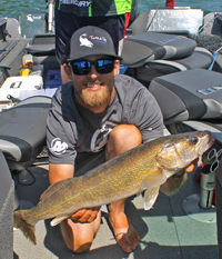 image of justin bailey with leech lake walleye