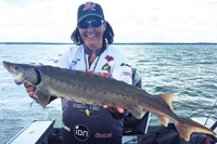 image of nancy koep with sturgeon