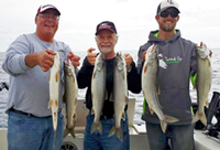 image of greg clusiau with bailey and carpenter showing off 6 trout