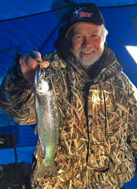 image of Greg Clusiau with Rainbow Trout