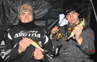 image of young men with walleyes on red lake