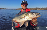 image of Justin Bailey with big Rainy River Walleye