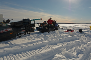 image of ice fisherman on snowmobile