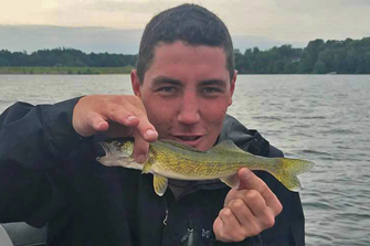 image of Taylor Crippa with tiny walleye