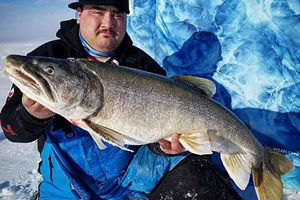 image of Andy Walsh with huge Lake Trout