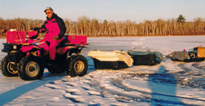 image of terry wickstrom pulling ice fishing sleds