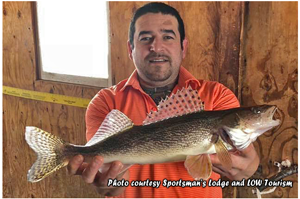 image of angler with big sauger