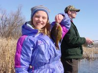 Katie Sundin with spring 
    breakup Bluegill caught fishing from shore