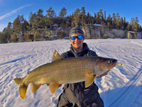 image of dylan maki with big lake trout