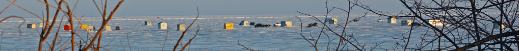 image of ice fishing shelters on lake mille lacs