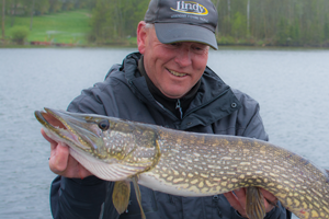 image of fishing guide with big pike