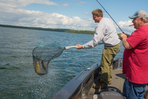 image of Brian and Will Rusch netting Walleye