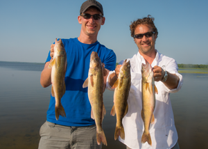 image of Mica and Ryan With keeper Walleyes