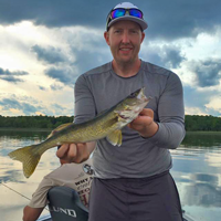 image of cody olson with walleye