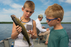 image of younsters with walleye