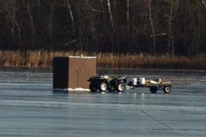 image of dark house on grand rapids lake