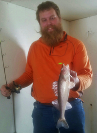 image of austin jones with lake of the woods walleye