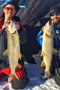 image of justin bailey and matt bruer with big lake trout
