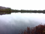 image of glassy smooth lake