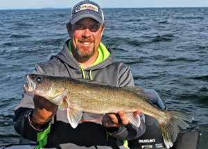 image of scott moe with mille lacs walleye