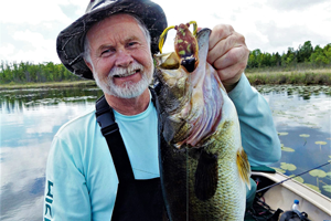 image of Greg Clusiau with Huge Largemouth Bass